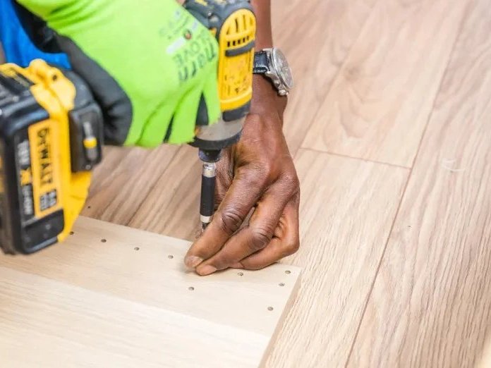 Flooring contractor installing wood floors in Peoria, AZ